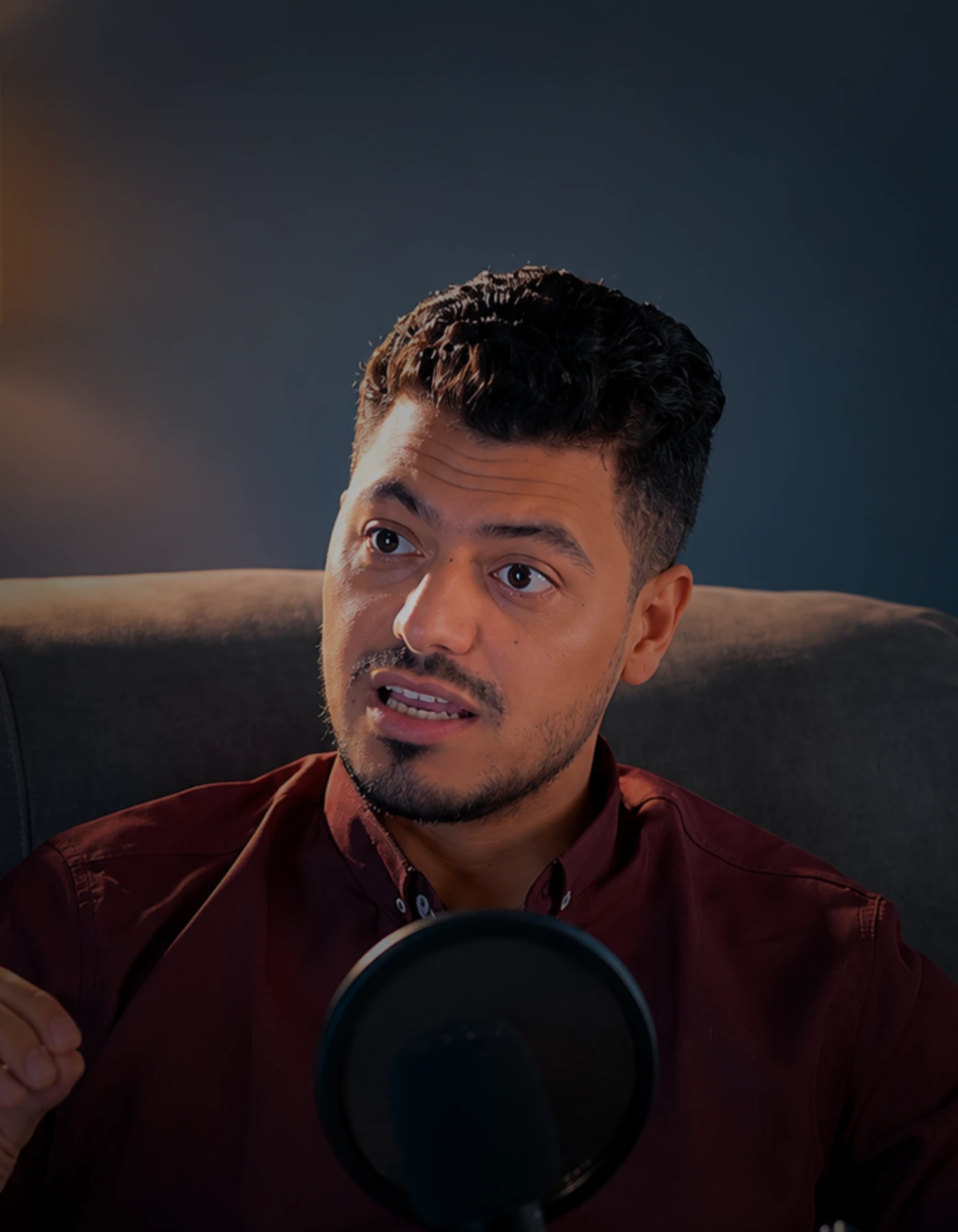 Ahmed Ayad in a dark editorial portrait